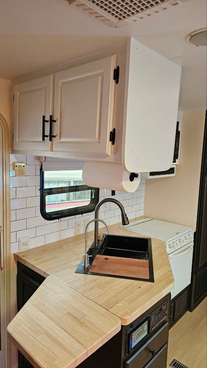 Real compact kitchen refresh with refinished cabinets and a solid wood countertop
