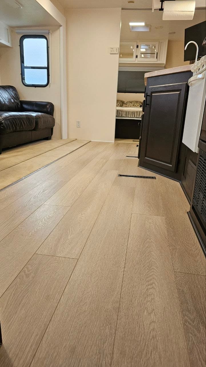New flooring installed through the travel trailer living space